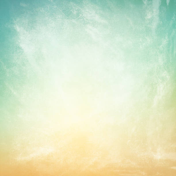 istock clouds on a textured vintage paper background 495914135