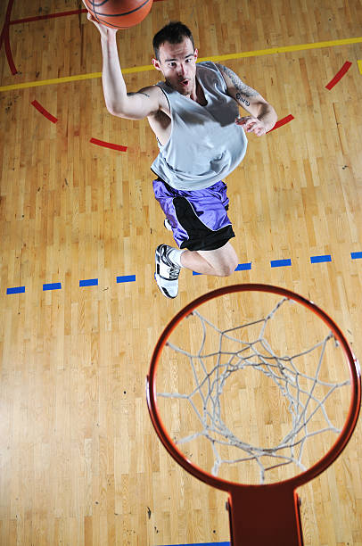 istock basket ball game player at sport hall 495914309