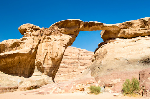 View through a rock arch in the desert of Wadi Rum Jordan