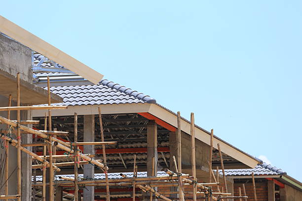 istock roof under construction for home building 495914595