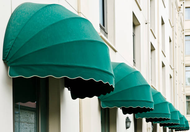 istock Green Awnings Over Windows in Hotel Wall 495917081