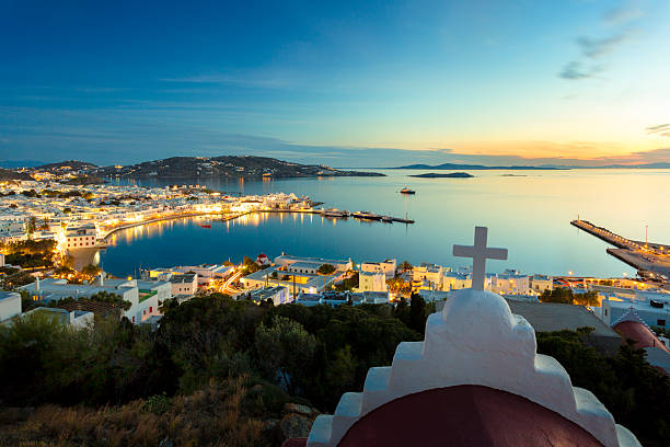 View from up to Mykonos town and harbor during sunset, nightshot,