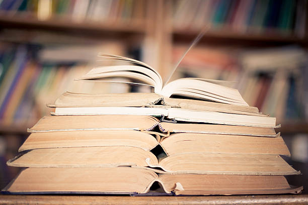 istock Books, open, table, defocused bookstand 495921246