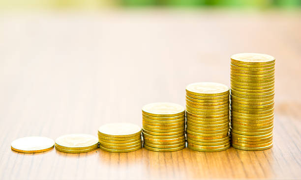 Growing bussiness gold coin graph concept stock photo