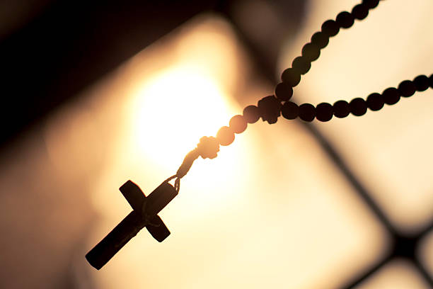 istock Rosary, cross, sun, window, background, space to text 495921406