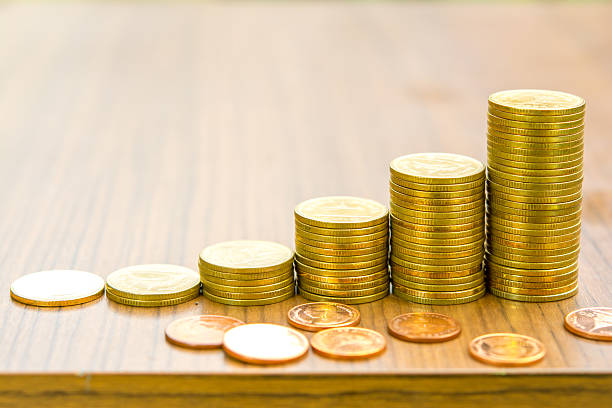 Growing bussiness gold coin graph concept stock photo