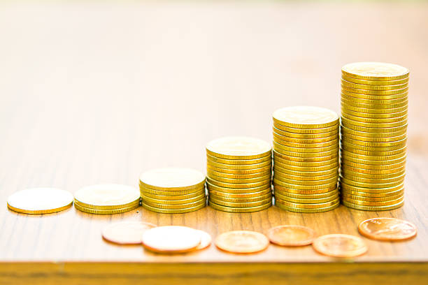 Growing bussiness gold coin graph concept stock photo