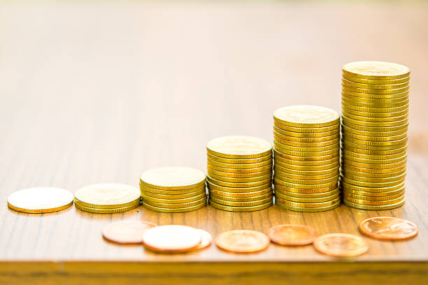Growing bussiness gold coin graph concept stock photo