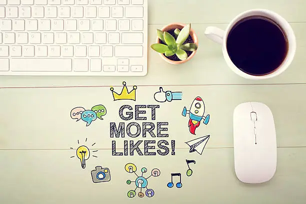 Photo of Get More Likes concept with workstation