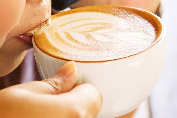 istock drinking a cup of hot coffee Latte 495922538