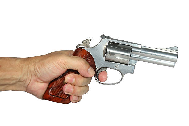 Killer holding a gun Killer holding a gun ready for shoot isolated on white background shooting guard stock pictures, royalty-free photos & images