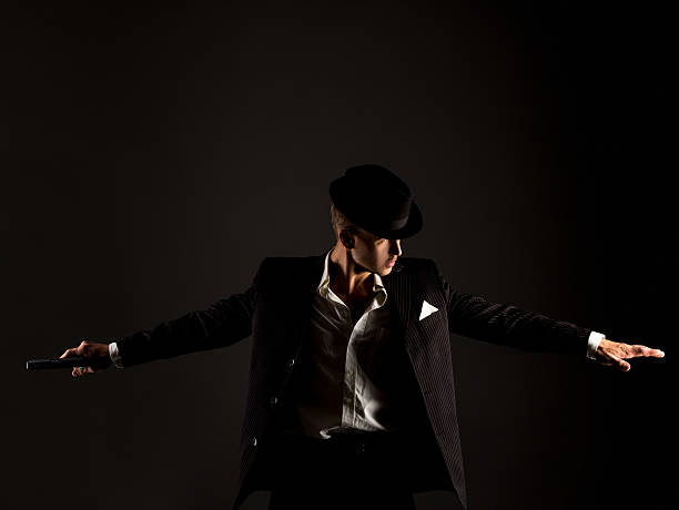 istock Studio photo of dancer dressed as gangster 495924236