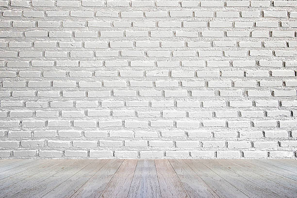 istock white brick wall and wood floor background 495924264