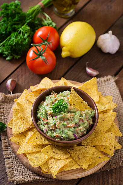 istock Guacamole avocado, lime, tomato, onion and cilantro, served with nachos 495925498
