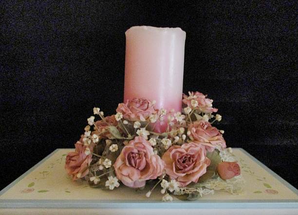 istock Pink Candle with Pink Roses and Baby's Breath 495925712