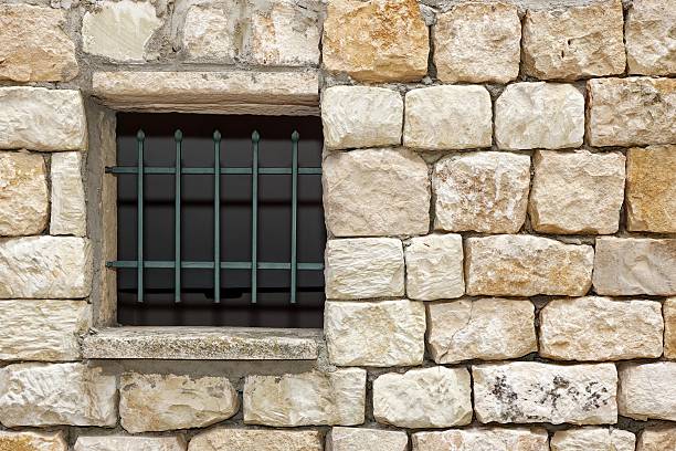istock Old White Stonewall With Lattice Window Detail Background 495926474