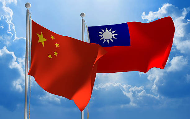China and Taiwan flags flying together for diplomatic talks Flags from China and Taiwan flying side by side for important talks. taiwan stock pictures, royalty-free photos & images