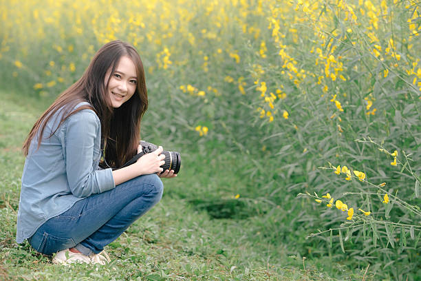 istock Traveler take a photo in Crotalaria Fields 495929802