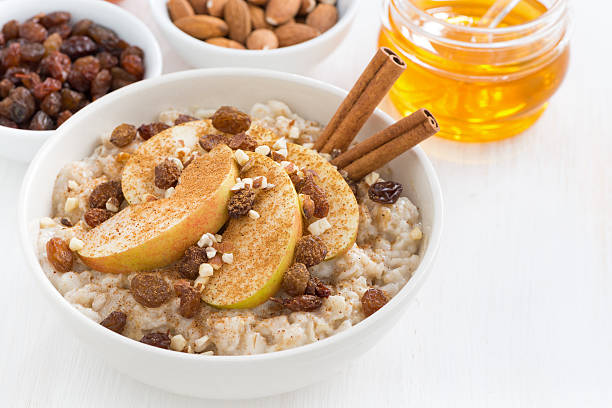 istock oatmeal with fresh apples, raisins, cinnamon and ingredients 495929982