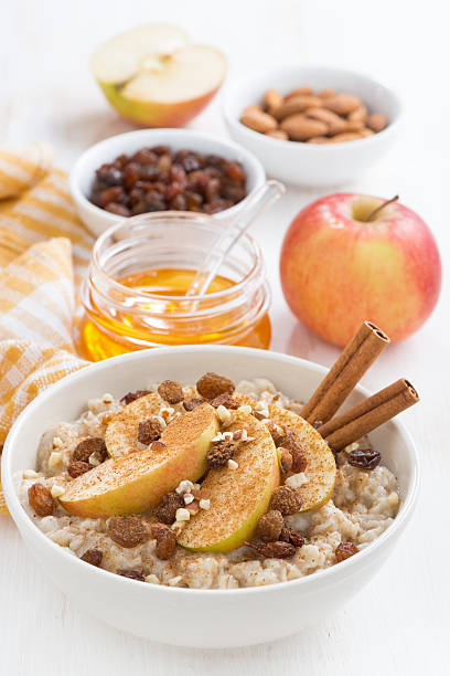 istock oatmeal with apples, raisins, cinnamon and ingredients 495930012
