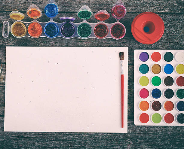 istock Watercolor paints set with brushes and paper sheet 495932326