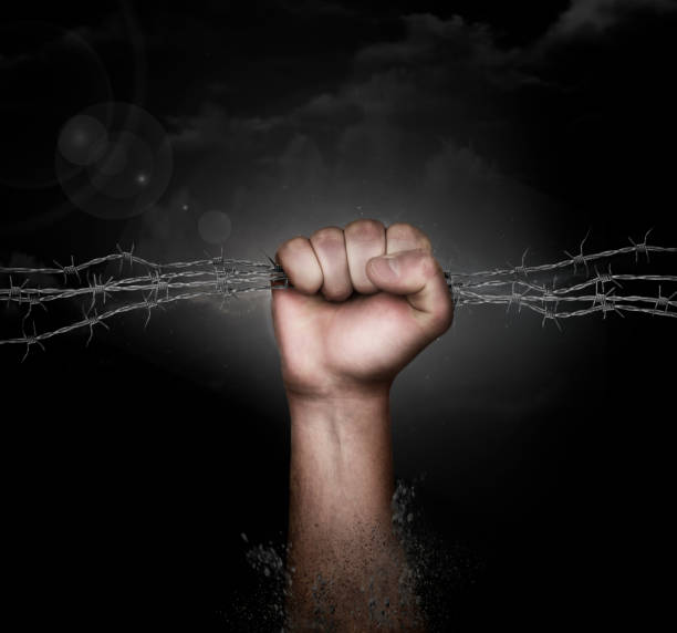 istock dirty hand grabbing a barbed wire 495933156