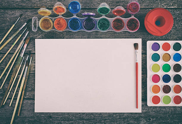 istock Watercolor paints set with brushes and paper sheet 495934250