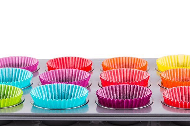 istock muffins baking tray with colourful paper cases 495949450