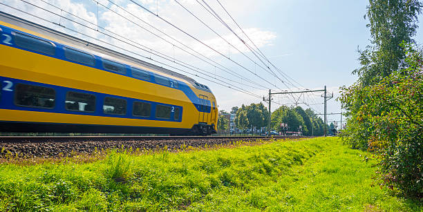 istock Passenger train driving at high speed in summer 495949662
