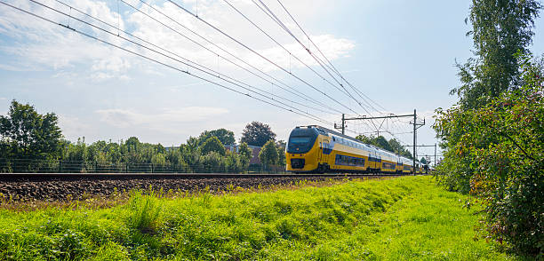 istock Passenger train driving at high speed in summer 495949684