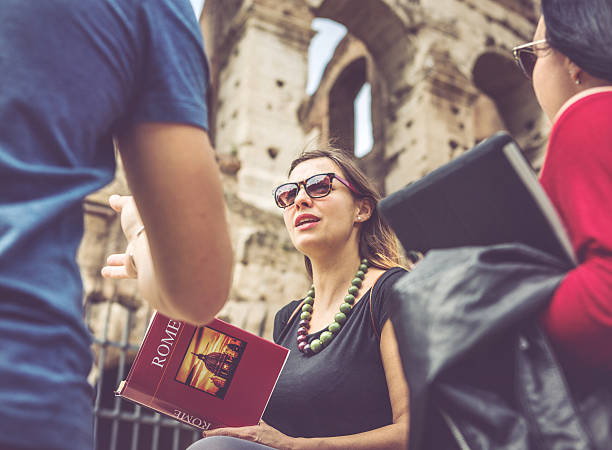 istock Tourists with a guide in front of the Coliseum, Rome 495949930