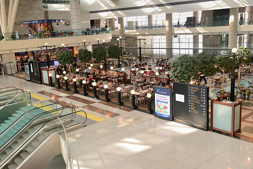 Ankara, Turkey - February 23, 2014: Esenboga Airport food court in Ankara. People eating and drinking before flight.