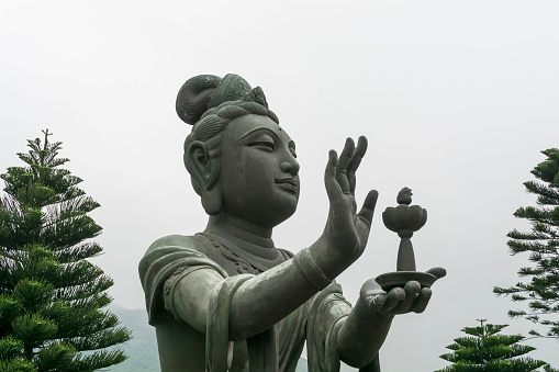 Buddhistic statue making offerings to the Tian Tan Buddha in Hong Kong
