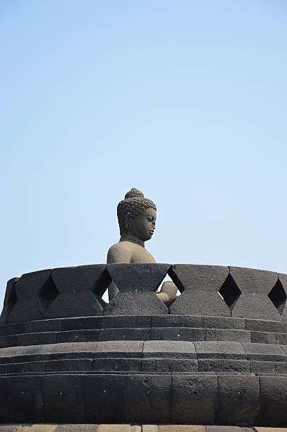 istock Sitting buddha inside a stupa at the Borobudur temple 495952732