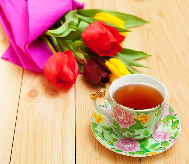 istock cup of tea with bouquet on wooden table 495954226