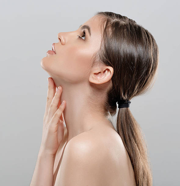 istock Beautiful woman face close up studio white sexy lips 495954812