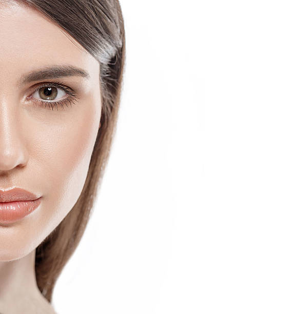 istock Beautiful woman face close up studio white sexy lips 495954874