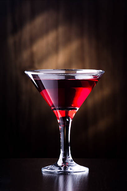 istock glass with juice on a dark background 495955440