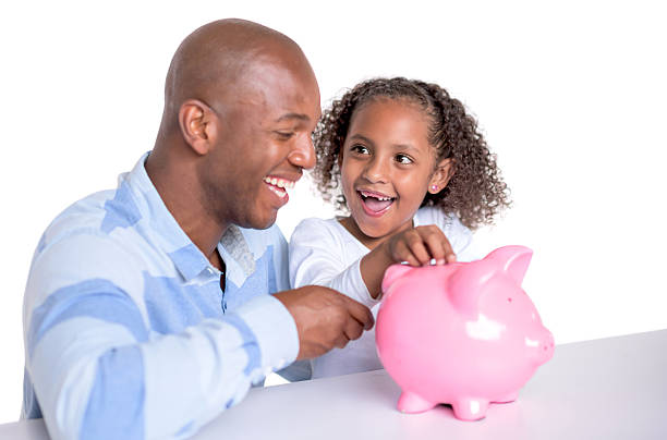 istock Man saving money with his daughter 495955610