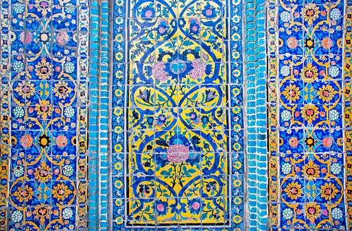 Colorful patterned wall with ceramic tiles of historical building in Iran