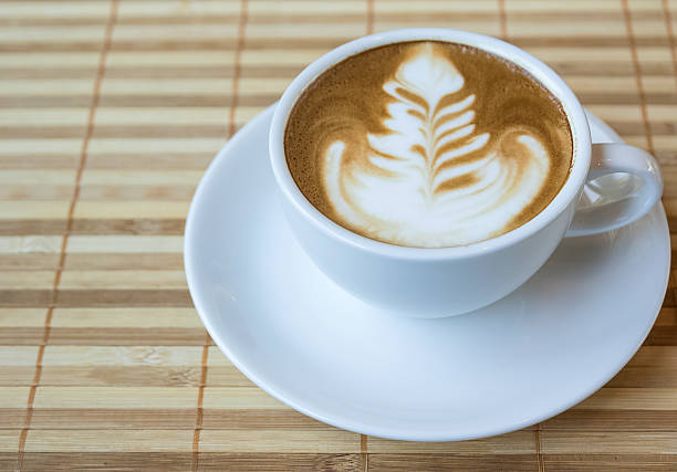 istock Cup of hot coffee with cinnamon sticks 495957612