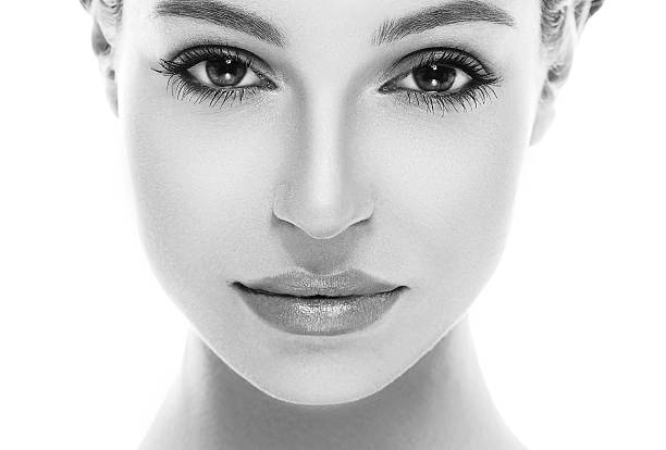 istock Beautiful woman face close up studio black and white 495958892