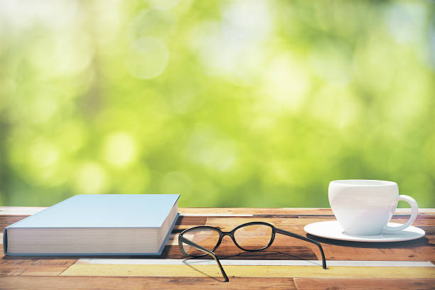 istock Book, cup of coffee and eyeglasses on a vintage table 495959566