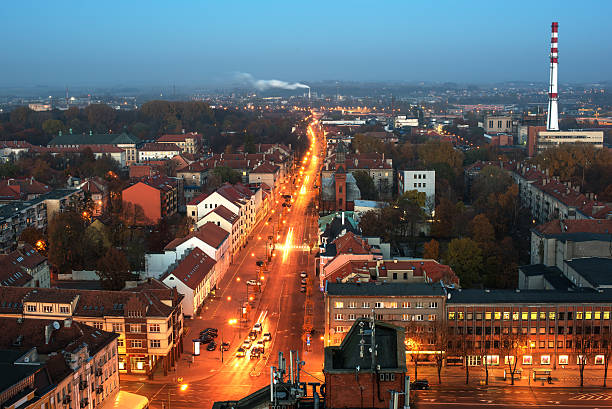 Representative aerial picture of Klaipeda, Lithuania in autumn sunset. Lights of Liepu street.