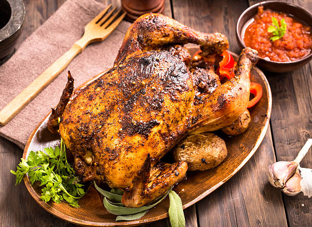 istock Roasted chicken on wooden plate 495962860