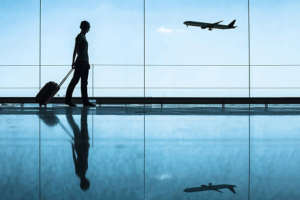 traveler in airport travel concept, people in the airport business travel stock pictures, royalty-free photos & images