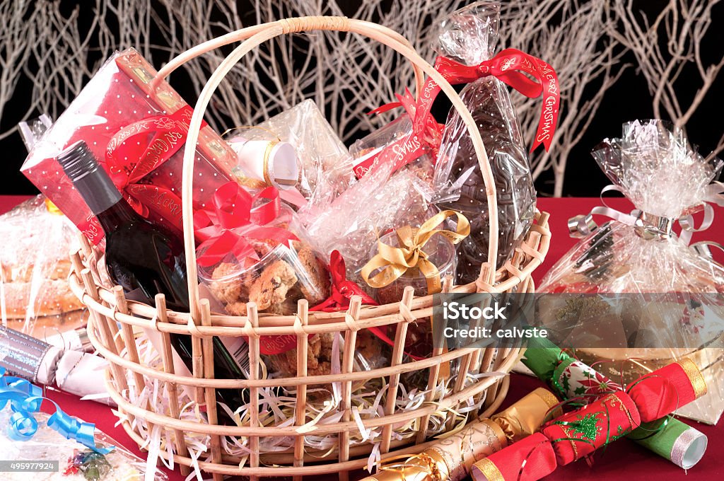 Christmas hamper basket Christmas hamper basket with a chocolate Santa, cookies and a bottle of wine close-up Basket Stock Photo