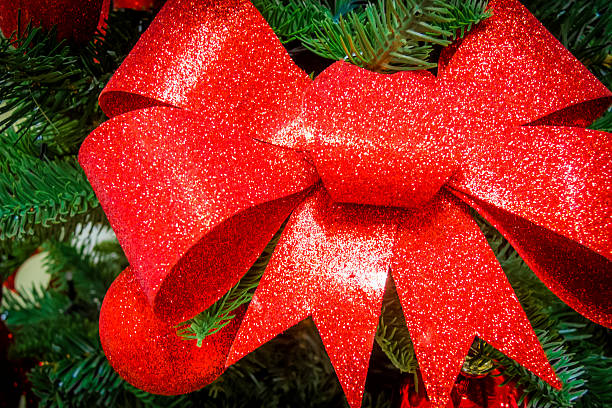 istock Closeup of a red bow in a Christmas tree 495978456