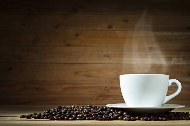 istock Coffee cup and coffee beans on wooden background. 495978698