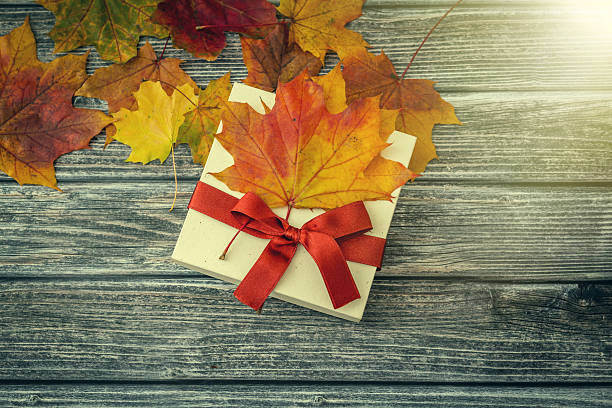 istock Autumn gift on wooden background 495978930
